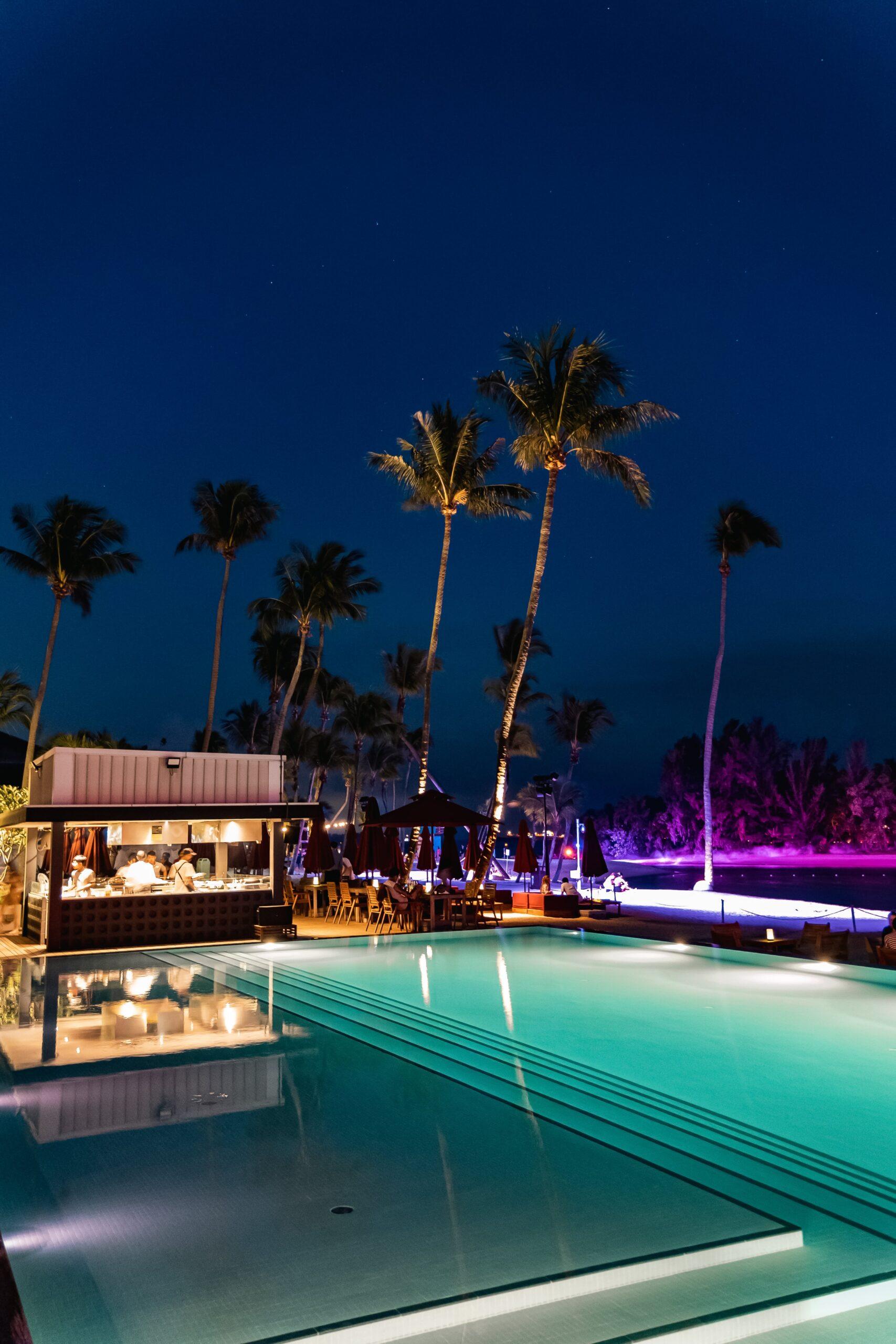 Image of a club at night with a swim up bar