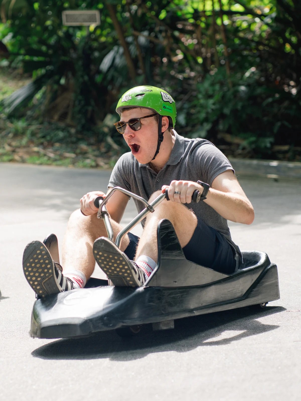 Skyline Luge Singapore - Man on Luge Cart visibly excited