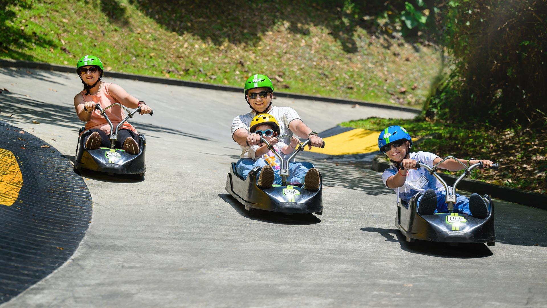 A family enjoying curves on the Luge track