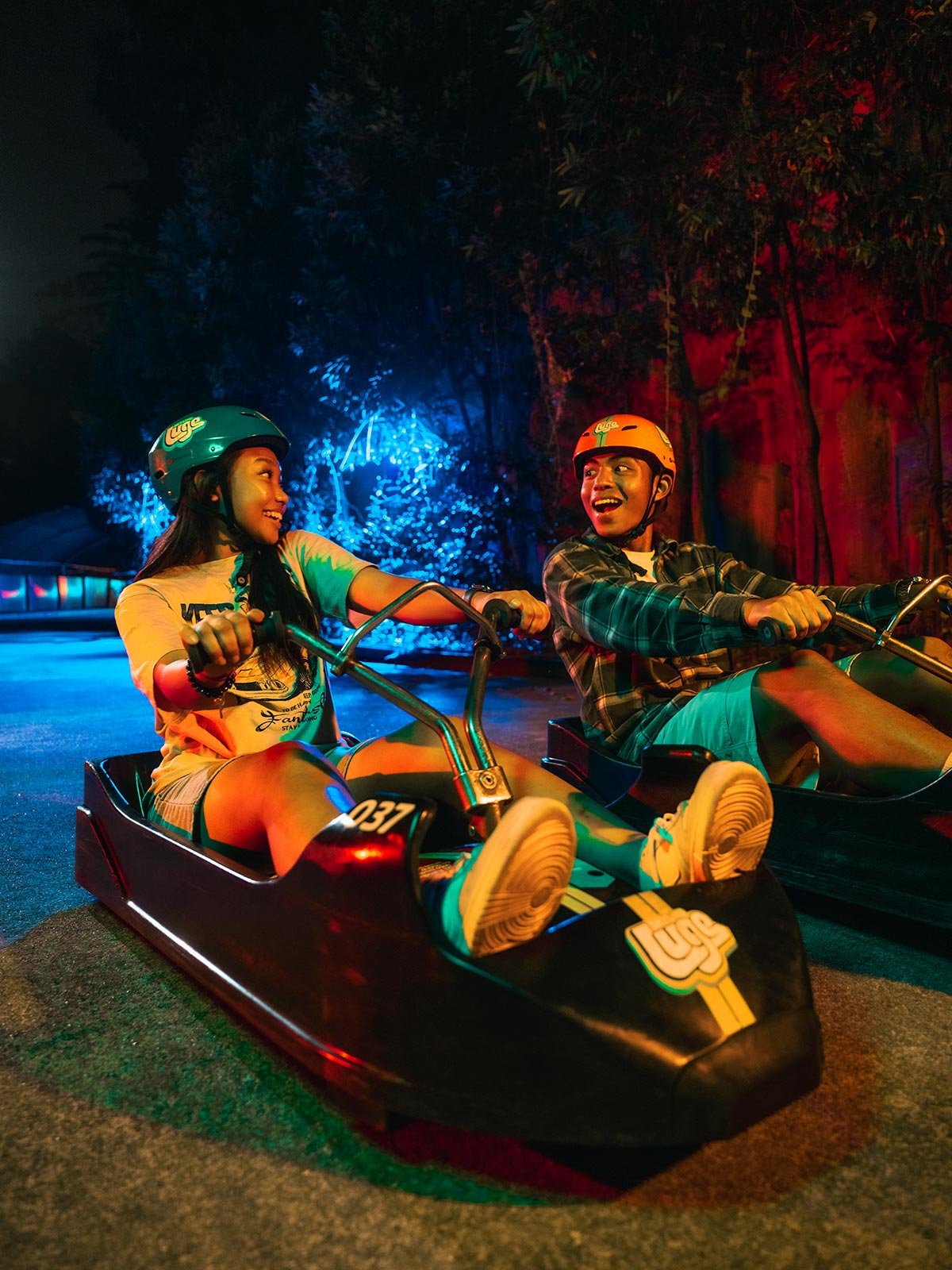 Skyline Luge Two Friends on Luge Carts for Night Luge
