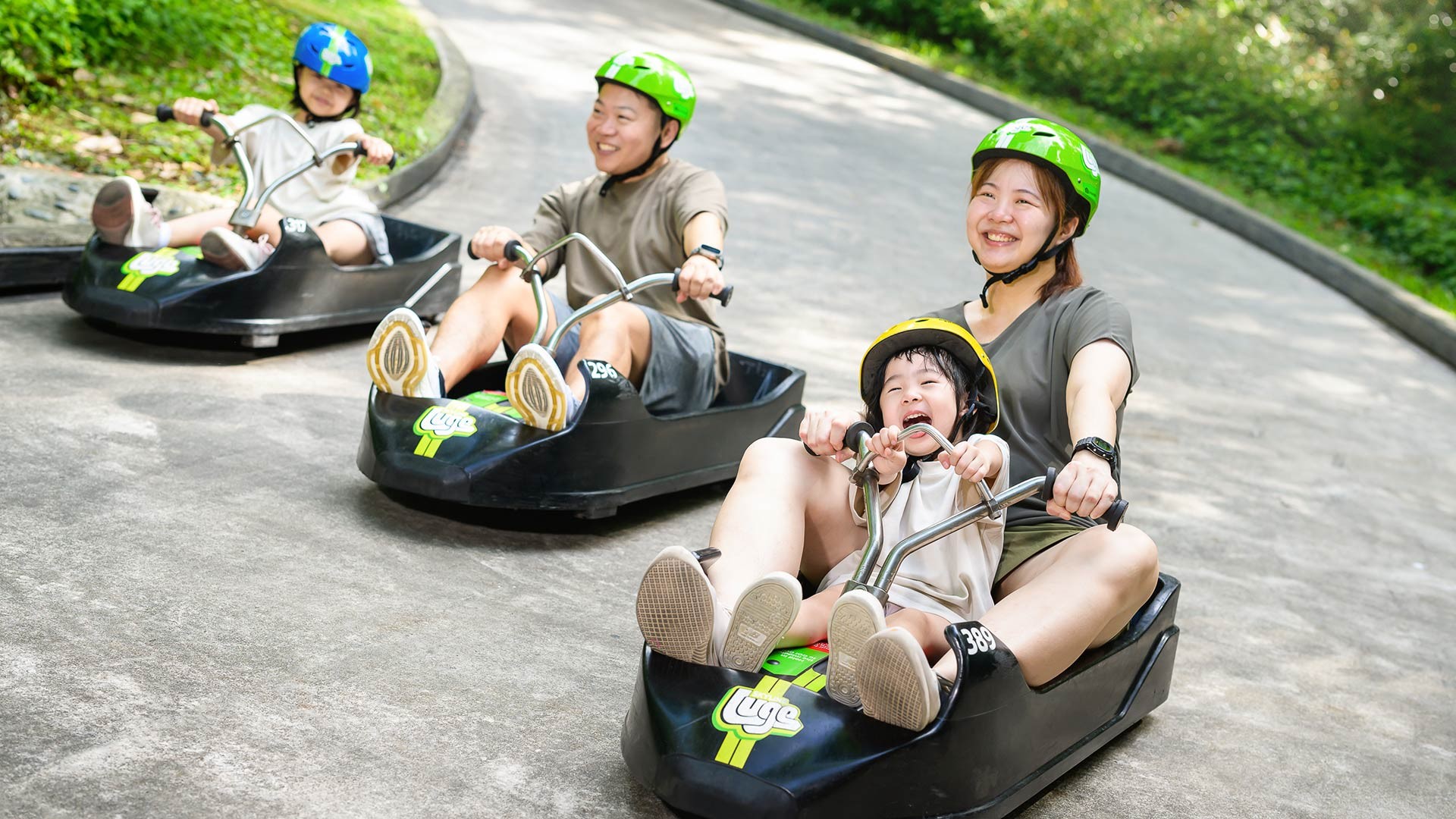 Skyline Luge a Family on Luge Carts having fun on the track twists and turns