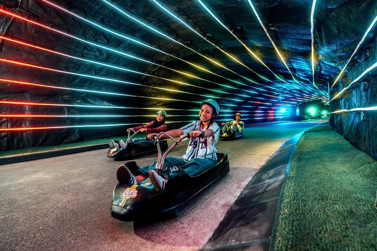 Skyline Luge Singapore a group of youths in Y2K fashion riding Luge Carts