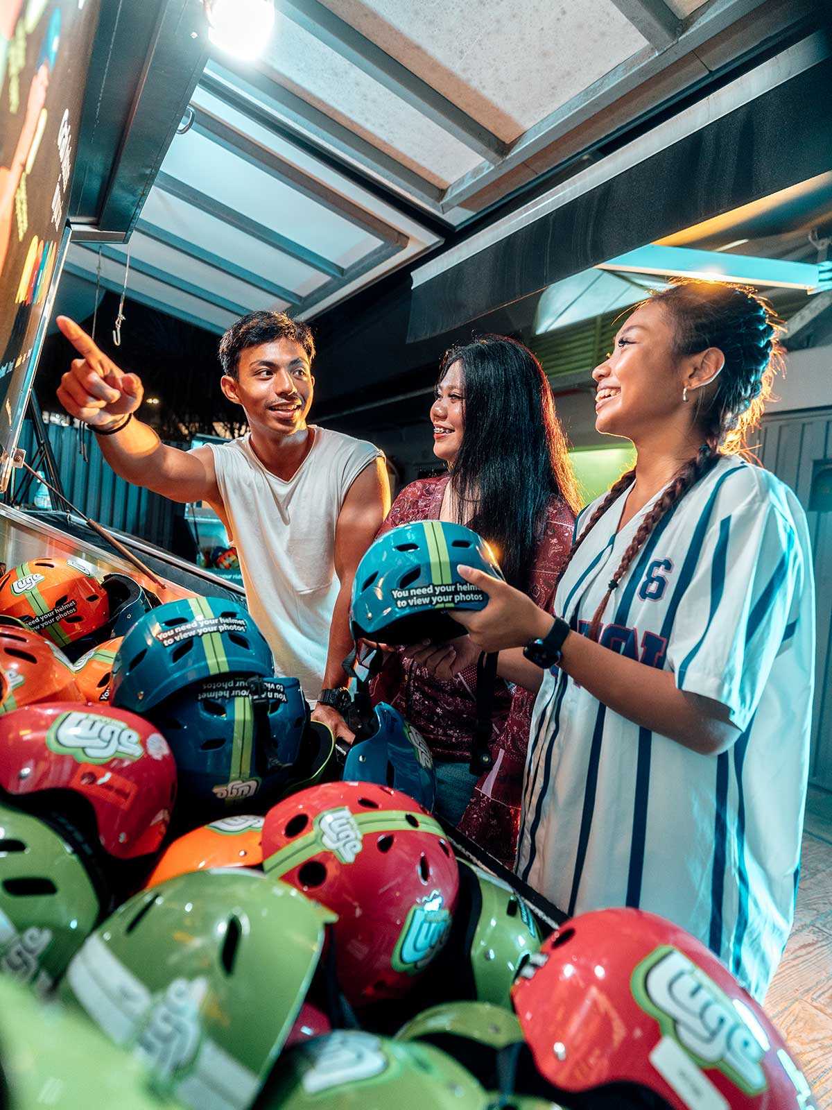 Skyline Luge Singapore A Group of Youths picking out their Helmets