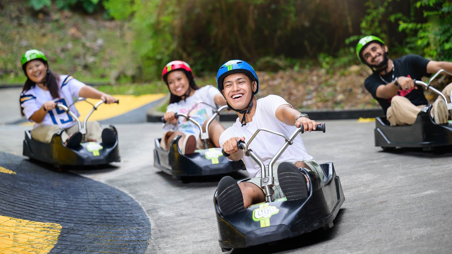 Skyline Luge A Group of Youths Smiling on the Tracks