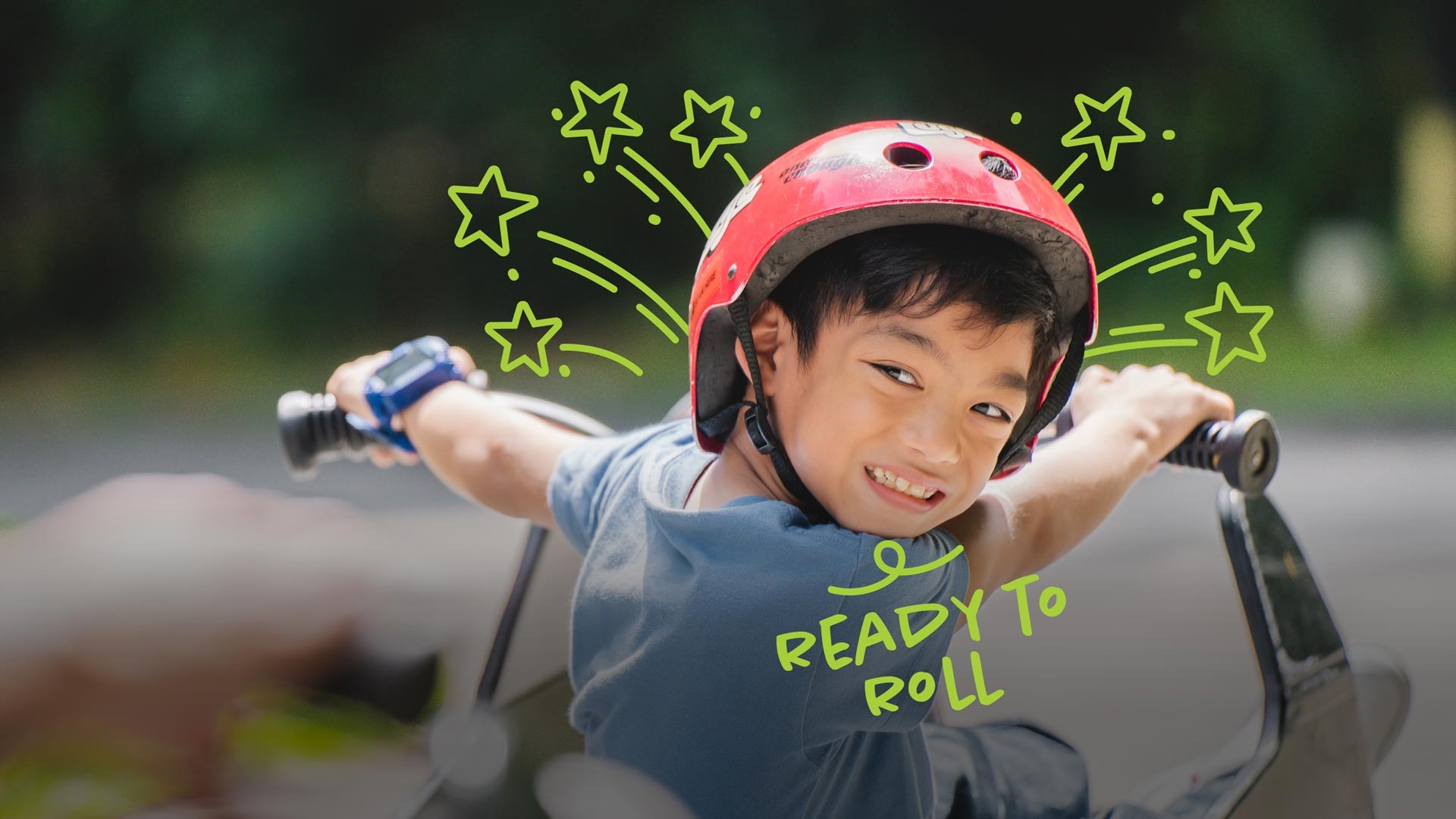 A child riding a Luge Cart looking back and smiling with the text "Ready to Roll" in sketchbook stylised font
